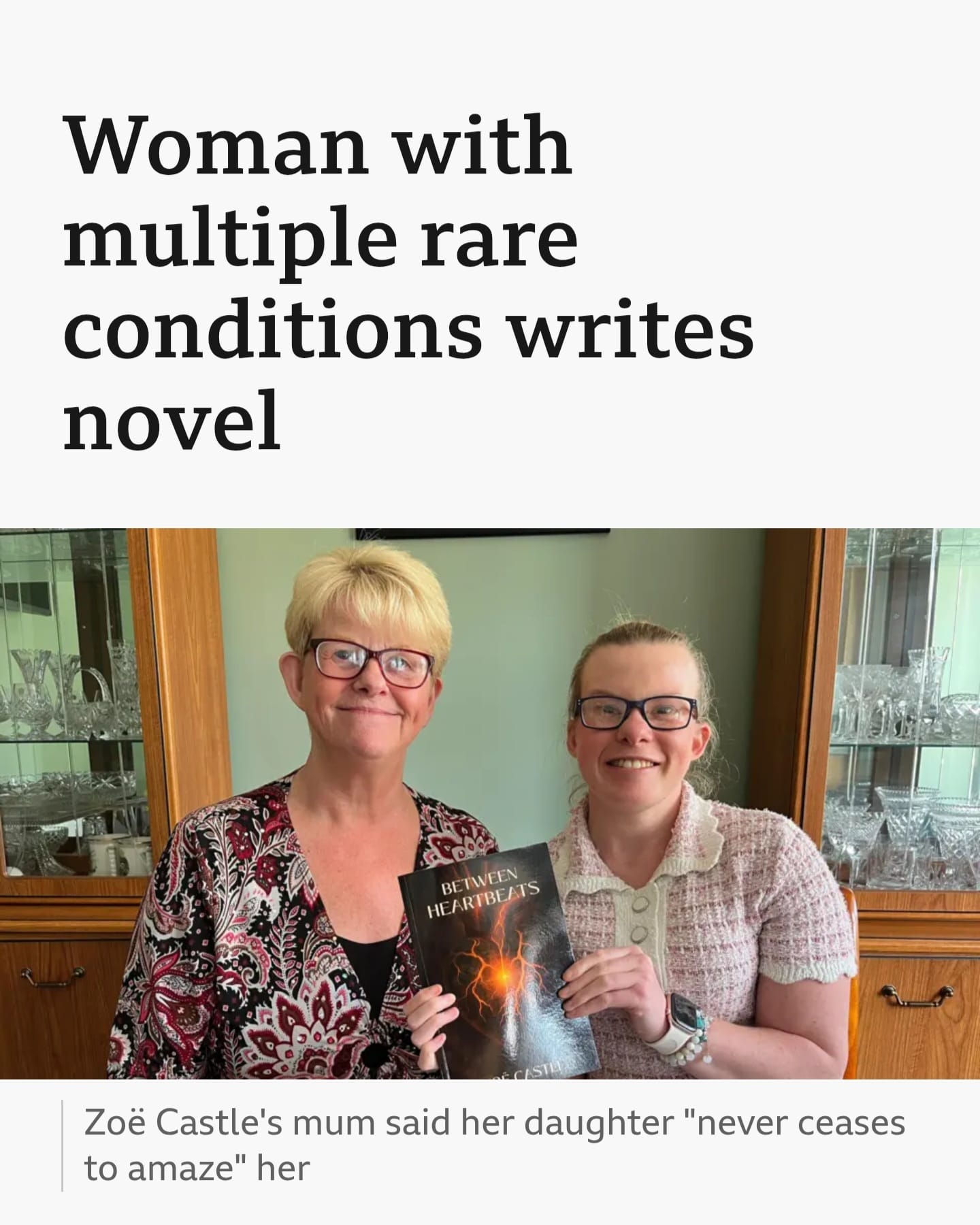 Zoë Castle and her mum holding a copy of the novel Between Heartbeats